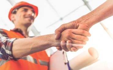 construction handshake dealio stock image