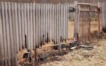 bushfire fence damaged stock image
