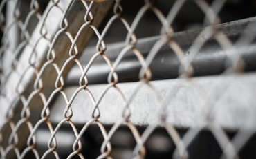 factory fence stock image